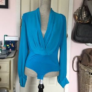 Blue plunging neck shirt size small